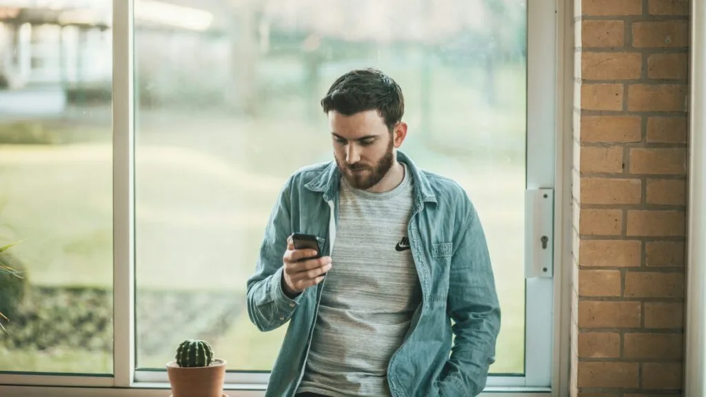 man texting on his phone
