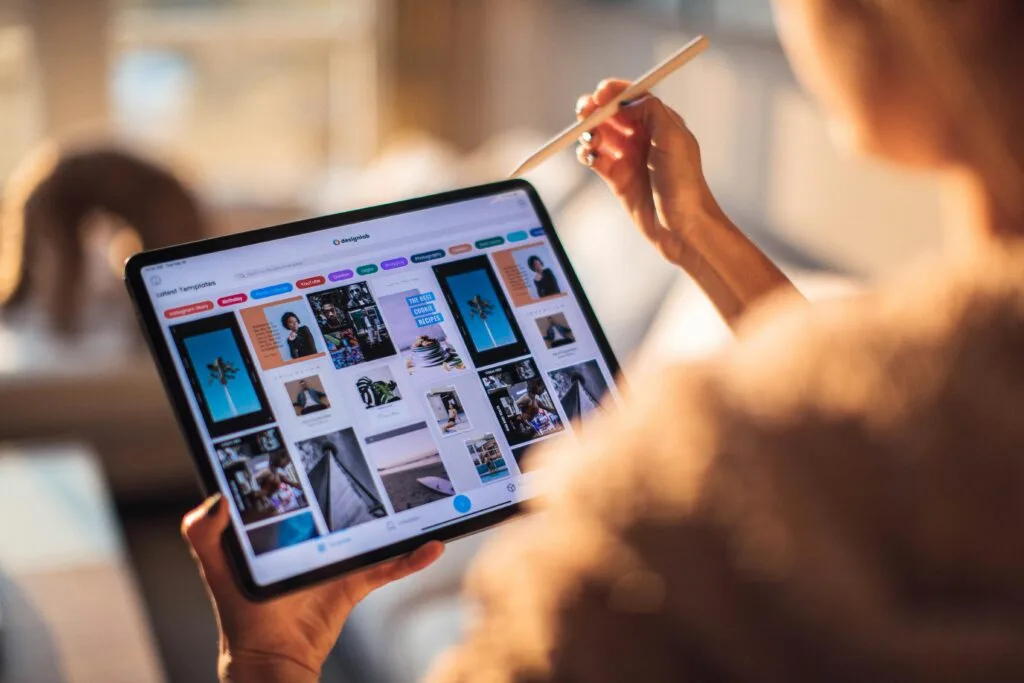 woman checking different apps on a tablet