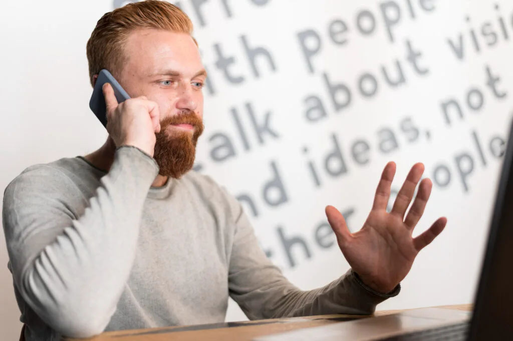 man talking on his phone with text on the background