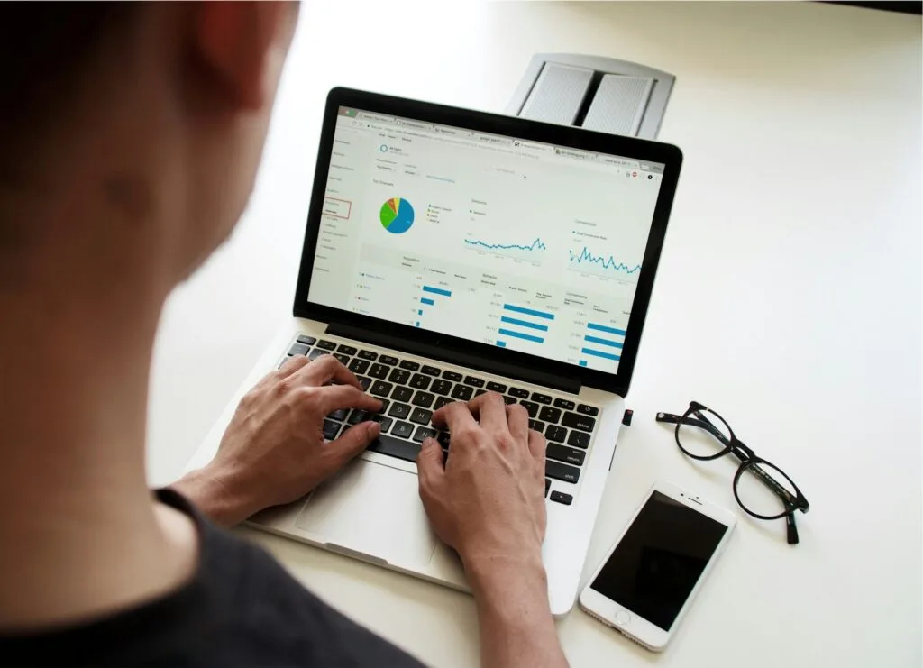 man checking SEO analysis on a laptop
