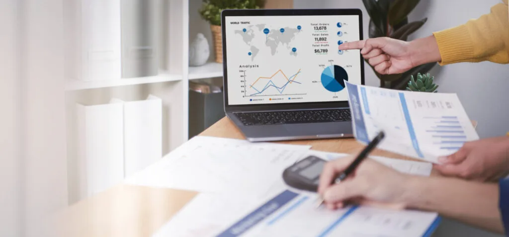 two people working on graphs