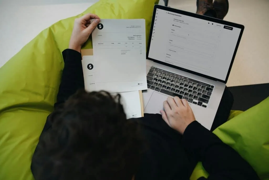 man using laptop for invoicing