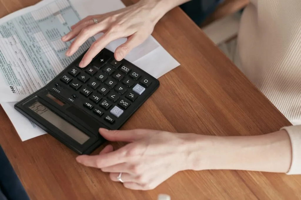 man using a calculator