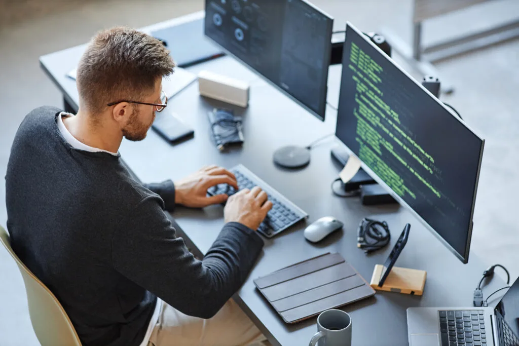 software programmer working on a computer