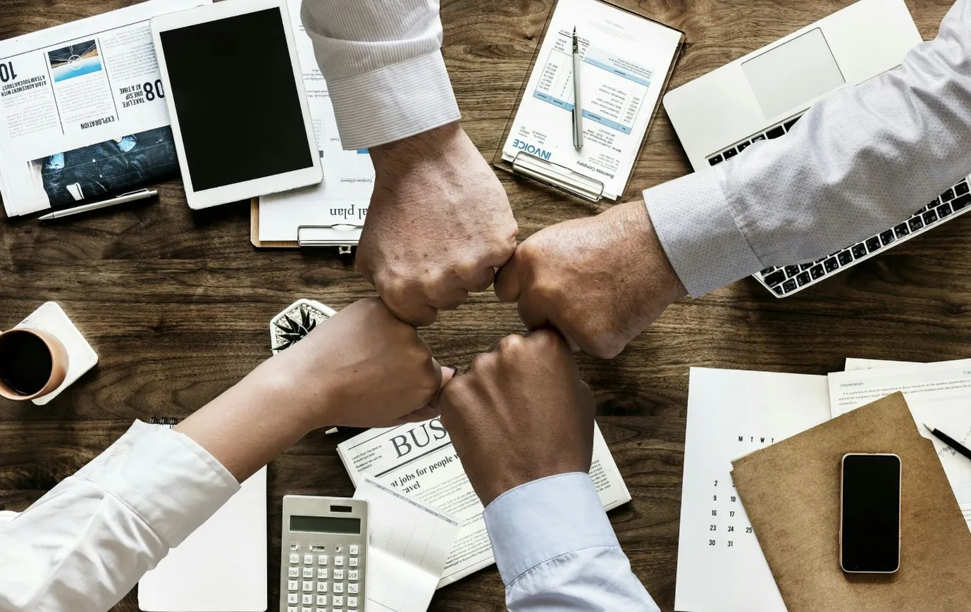 Team members collaborating around a conference table