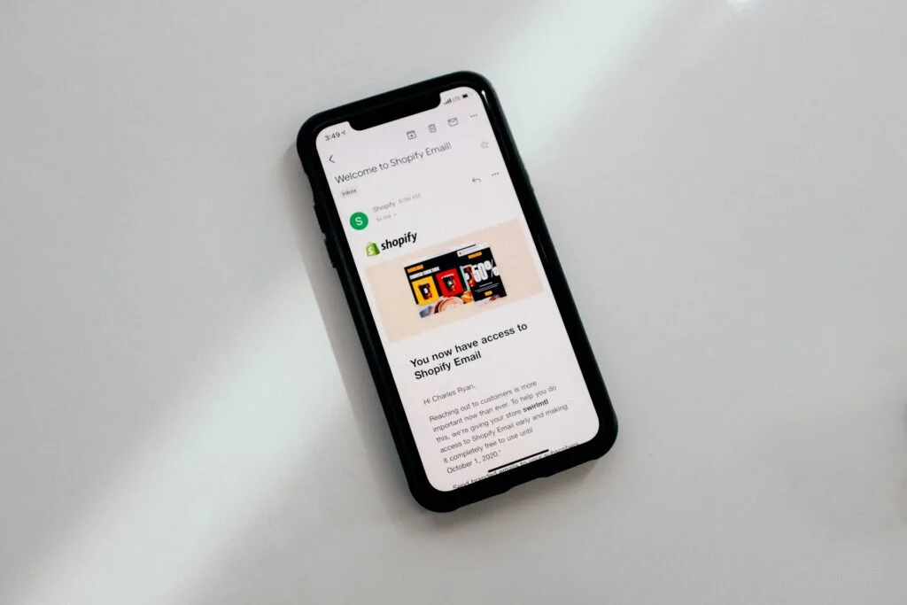 mobile phone showing shopify page