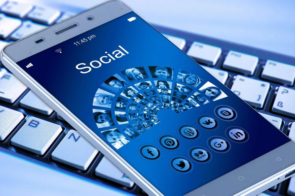 mobile phone displaying different social media icons