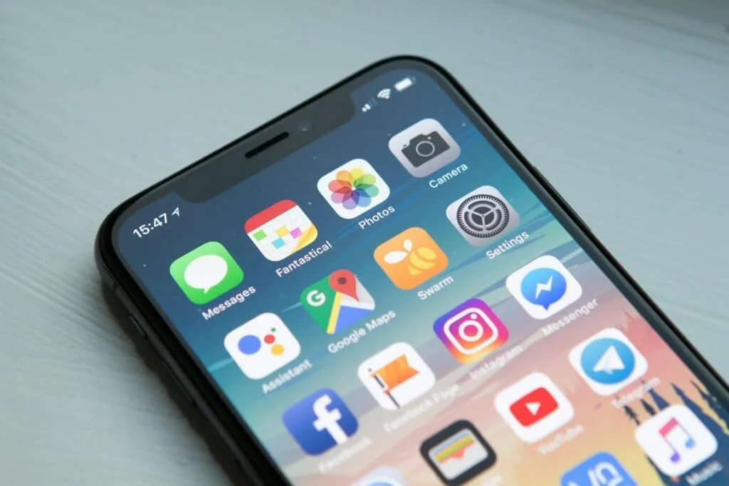an iphone displaying different app icons