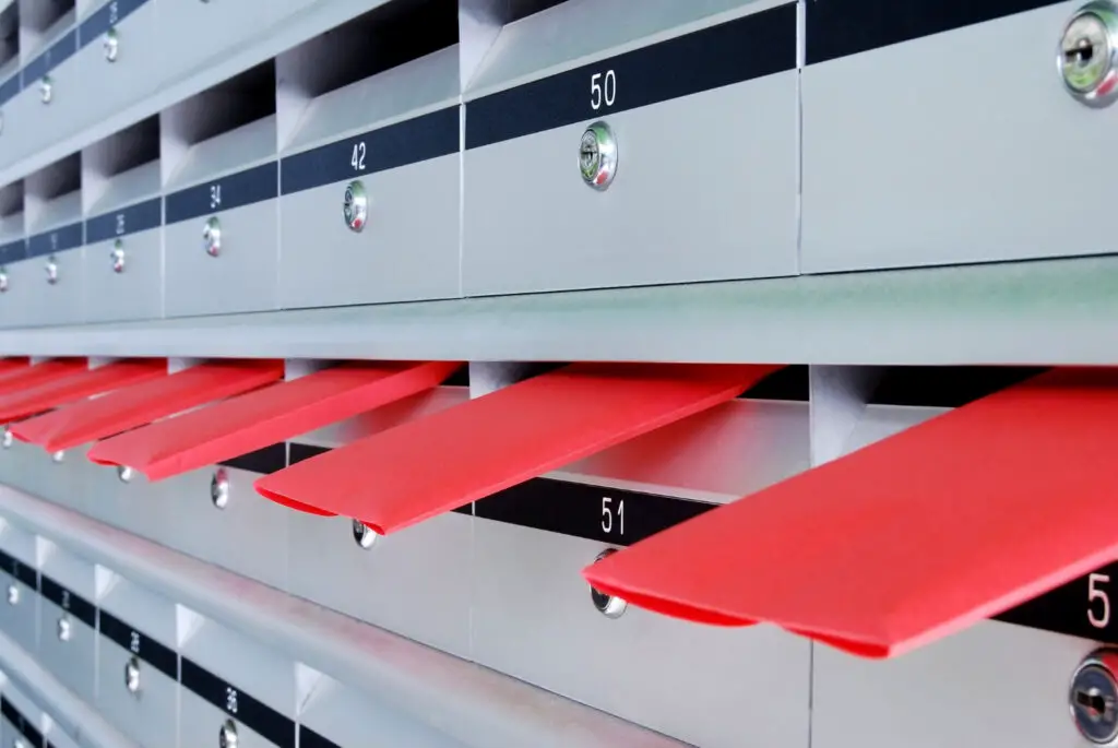 mailboxes with red envelopes