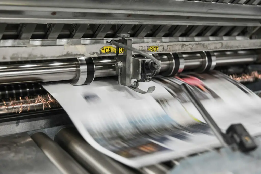 Printing newspaper using a printing press