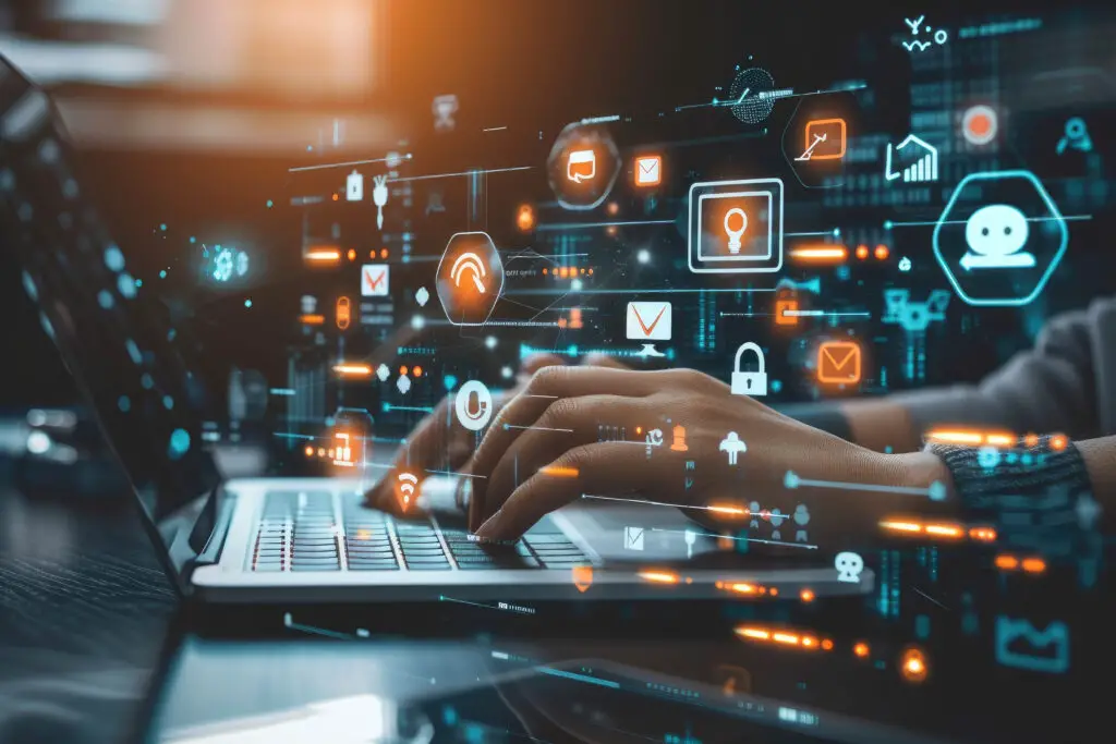 laptop with cybersecurity symbols displayed in the backdrop.