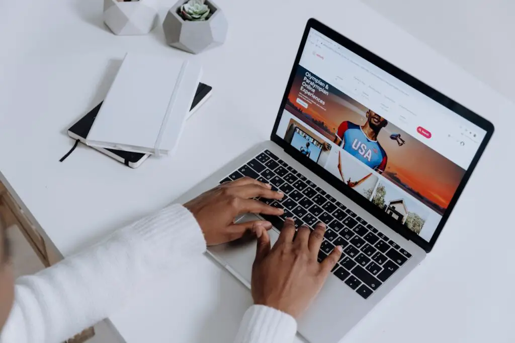 man working on his laptop with an open web browser