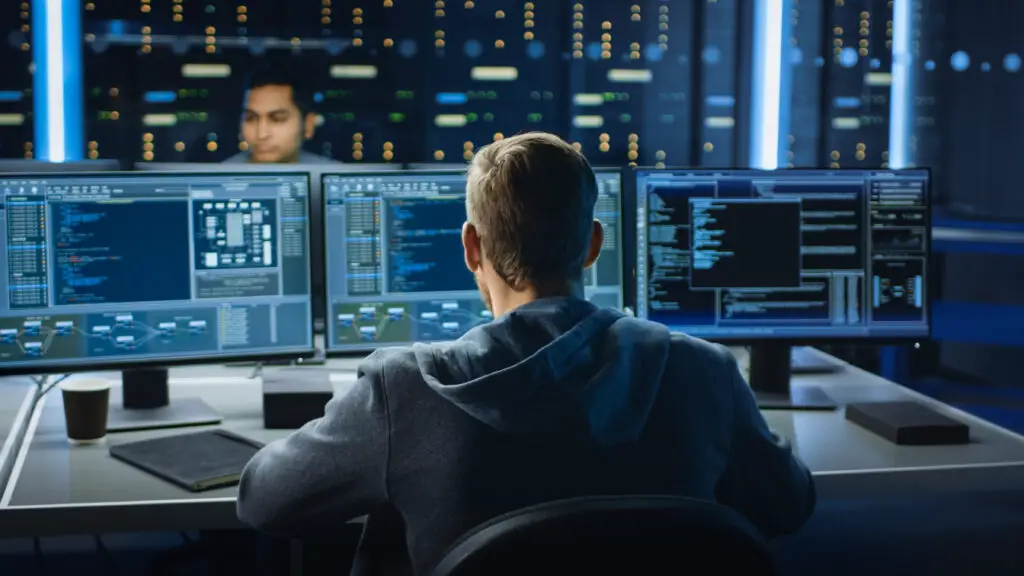 Cybersecurity concept. Man working on computer .