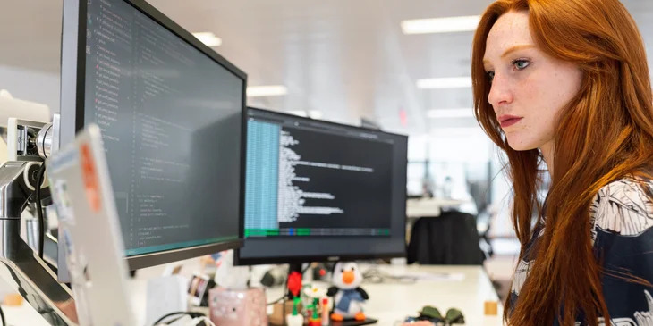 Red hair woman working on SEO.