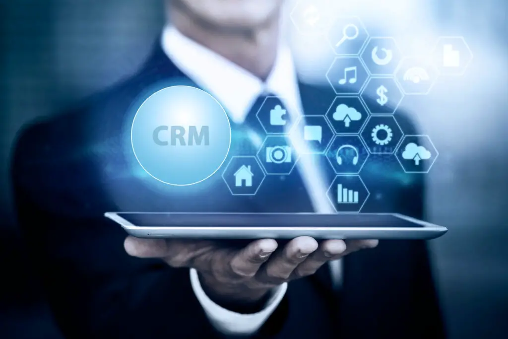 CRM concepts. Man holding a tablet.