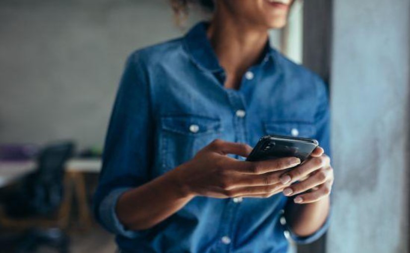 woman holding a smart phone