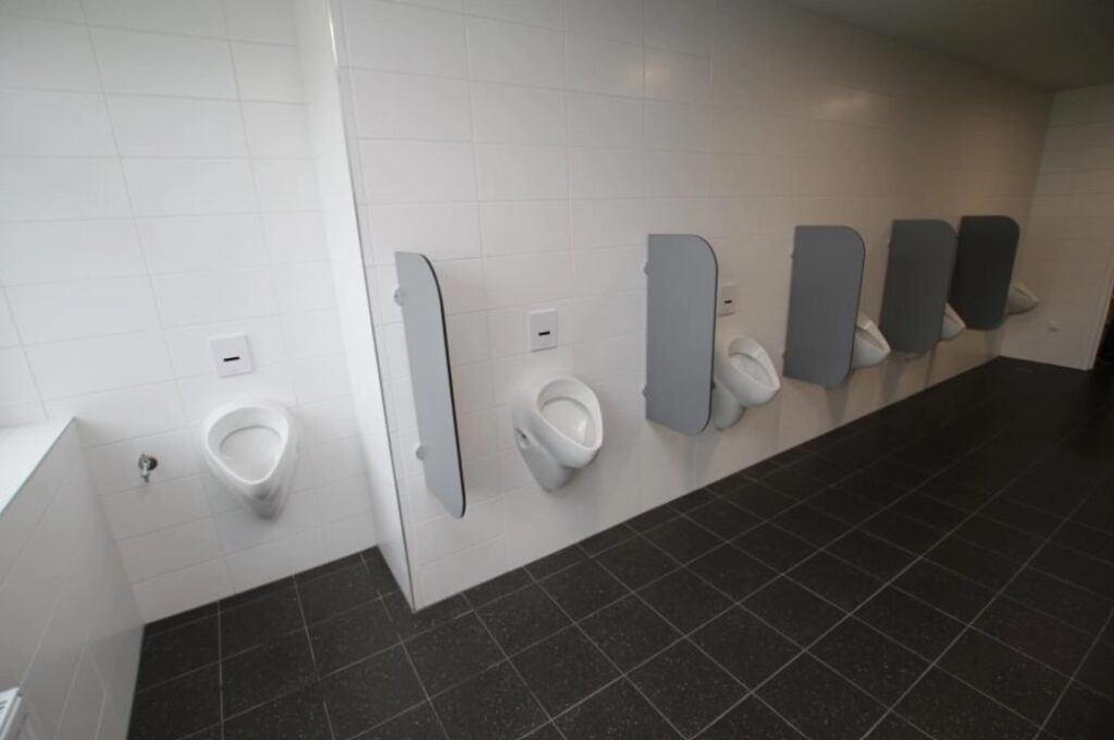 urinals inside a restroom