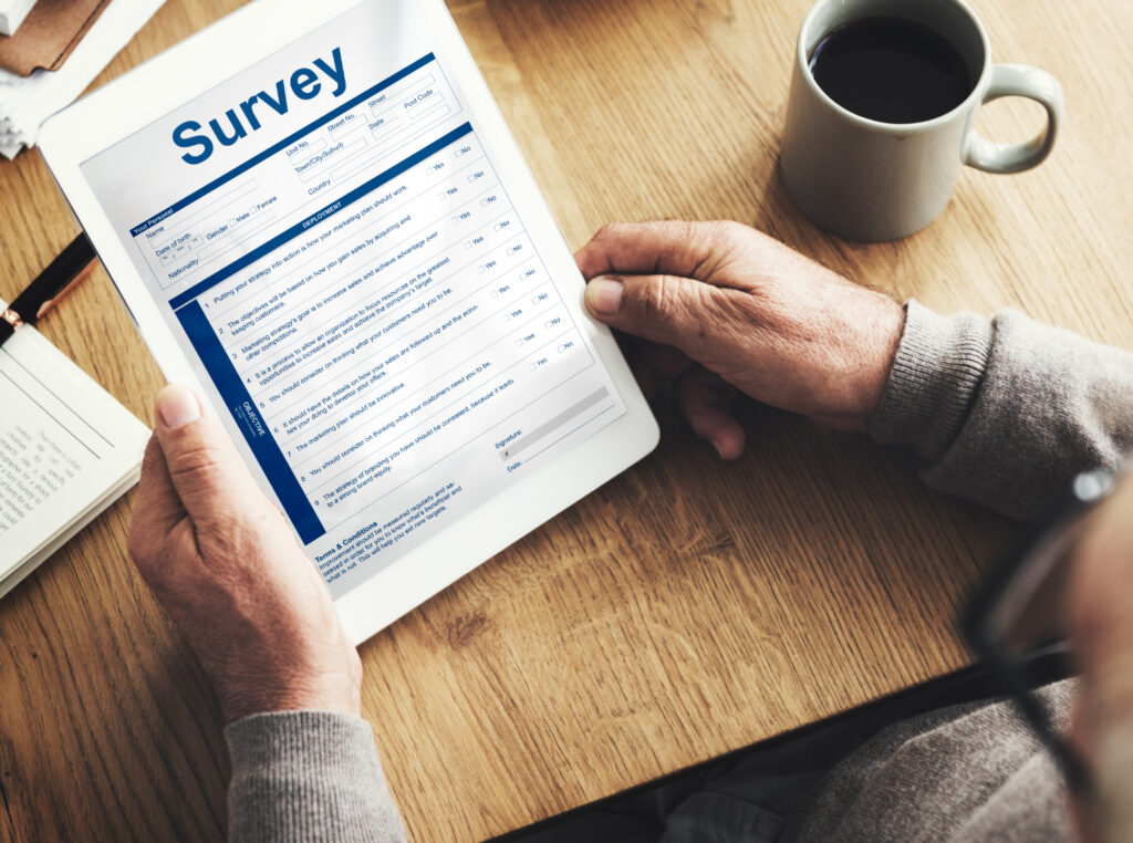 man holding a survey form