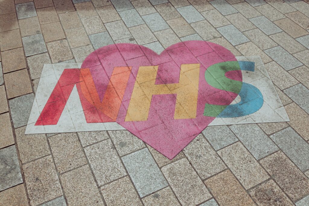 NHS logo with heart painted on road